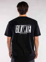 male model in a Black t-shirt with BLKWTE logo across the back in white 